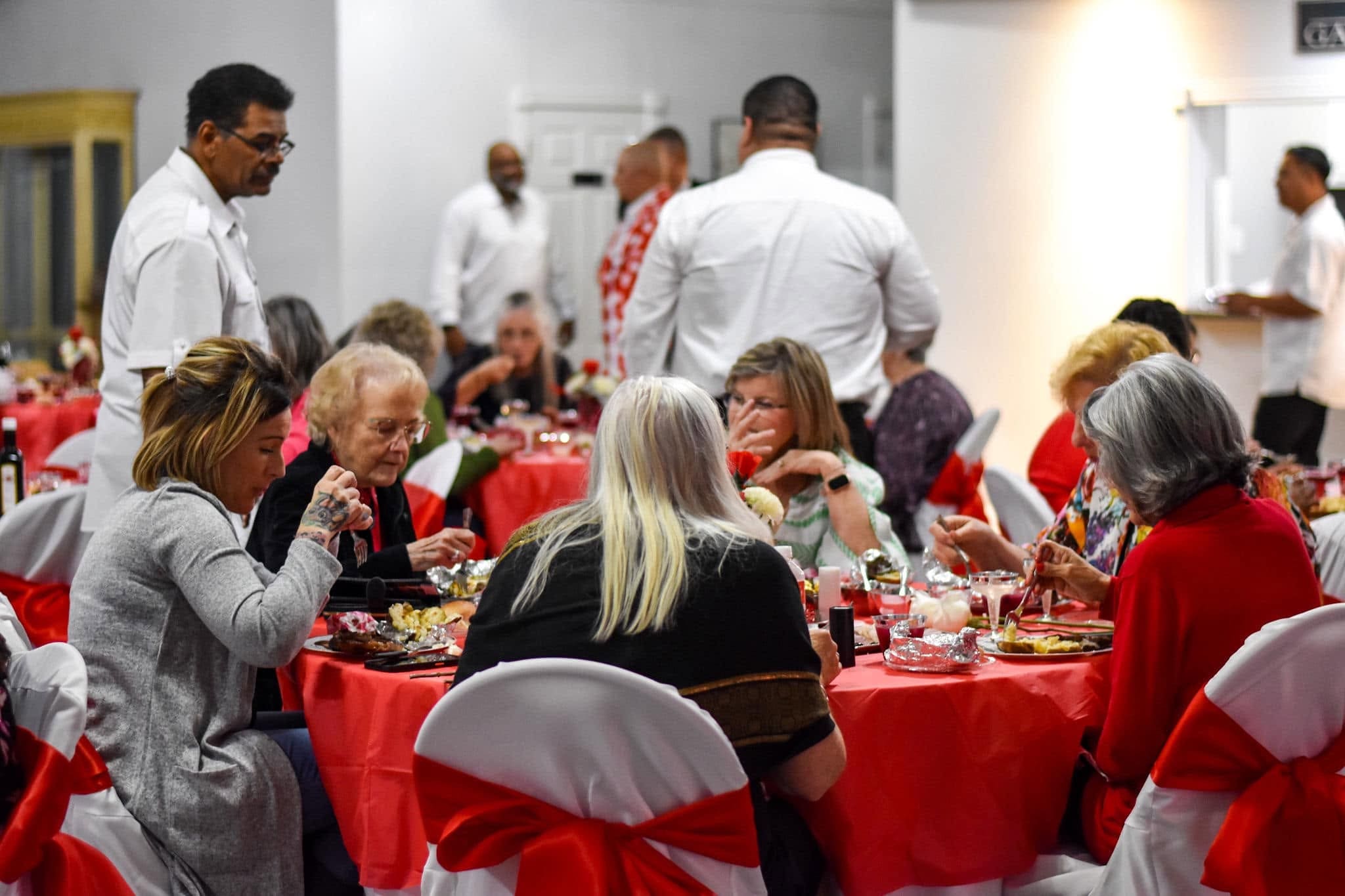 Agape church family sharing a meal together at the Valentine fellowship