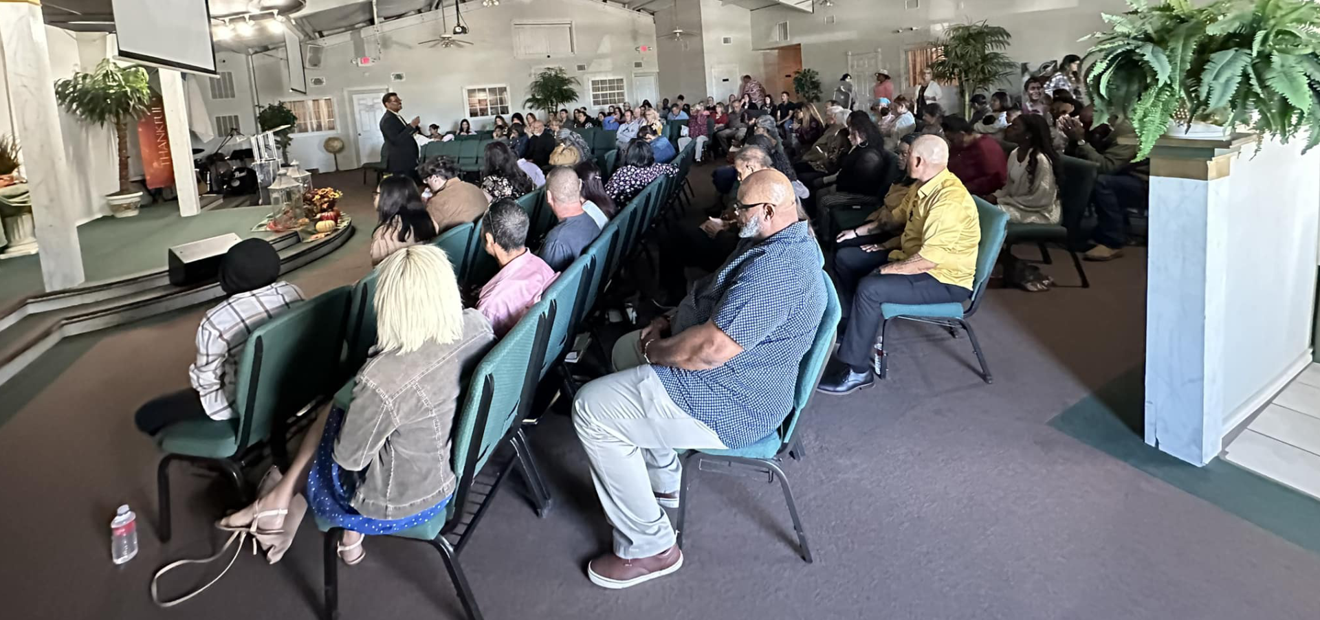 Agape congregation seated together during worship