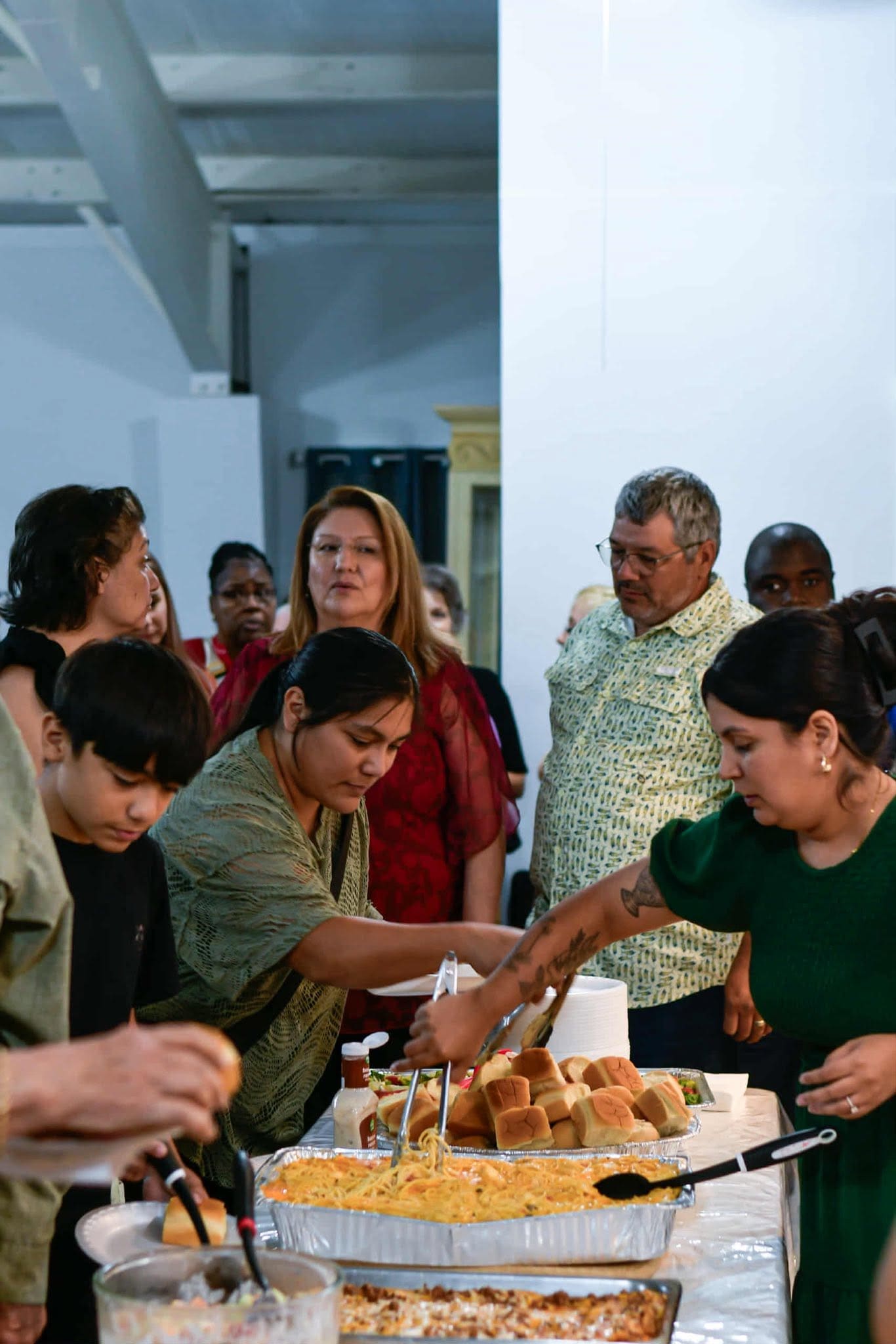 Church family gathering for fellowship at Agape Family Outreach Church