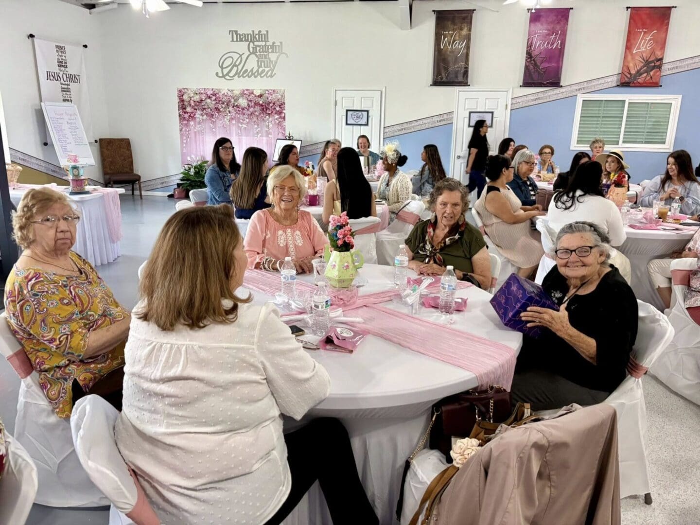 Table of women smiling with gifts