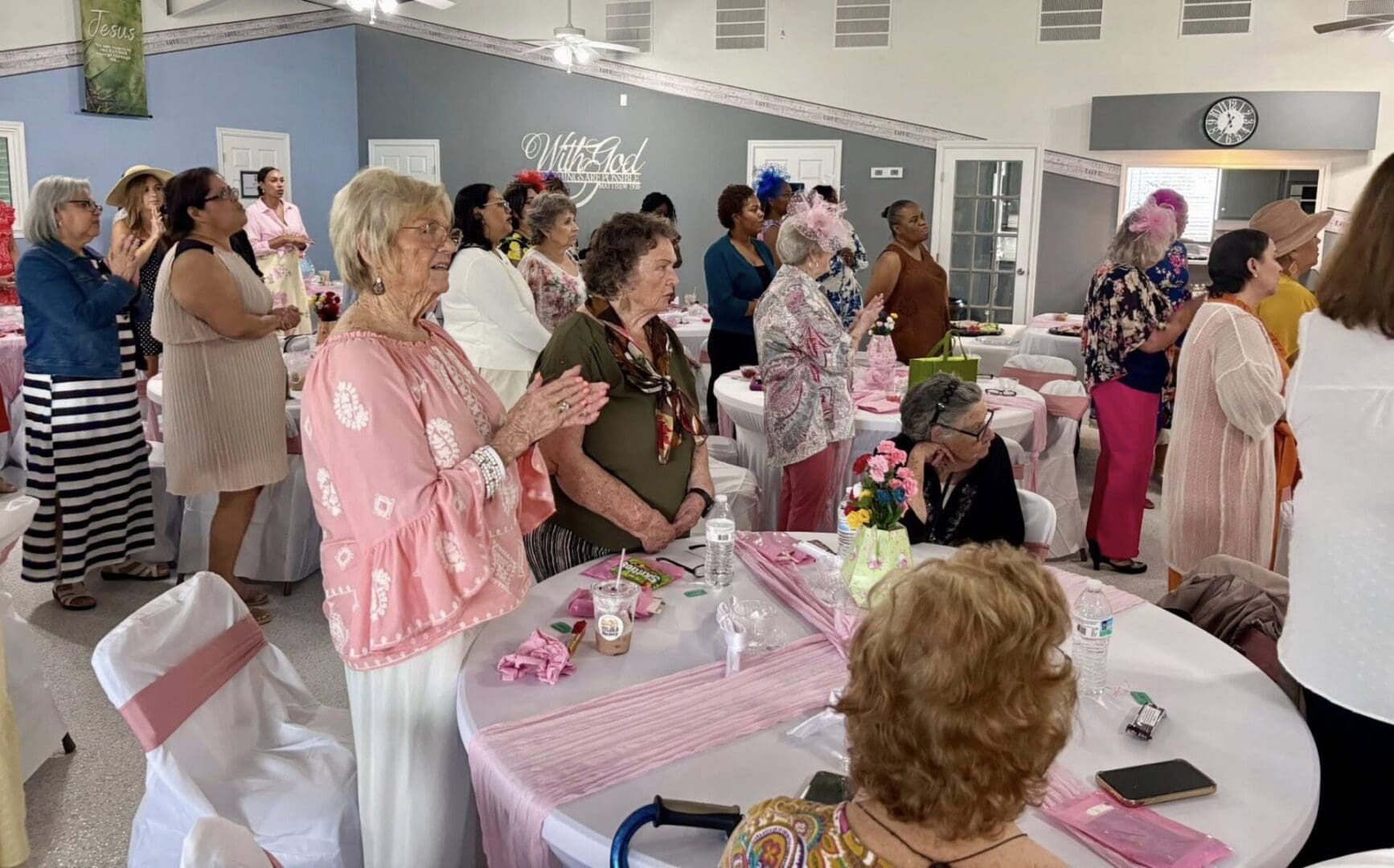 Women standing in praise and worship