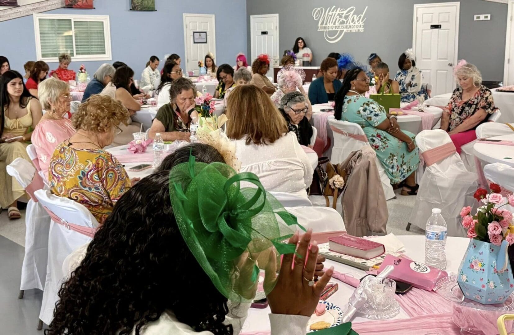 Women bowed in prayer